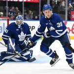 Sep 19, 2026; Toronto, Ontario, CAN; Toronto Maple Leafs defenseman Ben Danford (38) moves the puck away from the goal area of Anthony Stolarz (41) in the second period against the Montreal Canadiens at Scotiabank Arena.