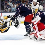 Oct 9, 2026; Columbus, Ohio, USA; Pittsburgh Penguins center Blake Lizotte (46) falls to the ice after a check from Columbus Blue Jackets defenseman Carson Soucy (7) during the second period at Nationwide Arena.