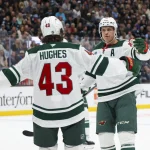 Oct 27, 2026; Salt Lake City, Utah, USA; Minnesota Wild center Joel Eriksson Ek (right) celebrates with defenseman Quinn Hughes (43) after scoring a goal against the Utah Mammoth during the second period at Delta Center.