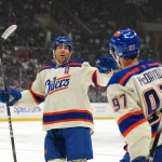 Oct 13, 2026; Los Angeles, California, USA; Edmonton Oilers defenseman Evan Bouchard (2) and center Connor McDavid (97) celebrate after a goal against the LA Kings in the first period at Crypto.com Arena.
