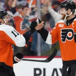 Apr 29, 2026; Philadelphia, Pennsylvania, USA; Philadelphia Flyers right wing Travis Konecny (11) reacts with center Sean Couturier (14) after game six of the first round of the 2026 Stanley Cup Playoffs against the Pittsburgh Penguins at Xfinity Mobile Arena.