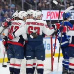 Apr 8, 2026; Toronto, Ontario, CAN; Washington Capitals defenseman Martin Fehervary (42) scores a goal and celebrates with left wing Ivan Miroshnichenko (63) against the Toronto Maple Leafs during the second period at Scotiabank Arena.