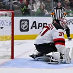 Oct 27, 2026; Dallas, Texas, USA; New Jersey Devils goaltender Connor Hellebuyck (37) gives up a goal to Dallas Stars center Justin Hryckowian (not pictured) during the second period at the American Airlines Center.
