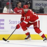 Oct 15, 2026; Detroit, Michigan, USA; Detroit Red Wings center Dylan Larkin (71) skates with the puck in the second period against the Philadelphia Flyers at Little Caesars Arena.