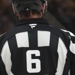 Feb 2, 2026; Pittsburgh, Pennsylvania, USA; The Fanatics logo on the sweater of referee Francis Charron (6) during the third period between the Ottawa Senators and the Pittsburgh Penguins at PPG Paints Arena.