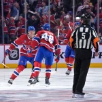 Apr 24, 2026; Montreal, Quebec, CAN; Montreal Canadiens defenseman Lane Hutson (48) celebrates with teammates including defenseman Kaiden Guhle (21) after scoring the winning goal against the Tampa Bay Lightning during the overtime period in game three of the first round of the 2026 Stanley Cup Playoffs at the Bell Centre.