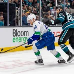 Oct 29, 2026; San Jose, California, USA; Vancouver Canucks center Elias Pettersson (40) controls the puck against San Jose Sharks right wing Barclay Goodrow (23) during the third period at SAP Center at San Jose.