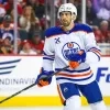 Evan Bouchard launches relationship with former Oilers hockey ops employee