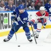 Nick Robertson reaches an agreement before arbitration what it could mean for Kirby Dach